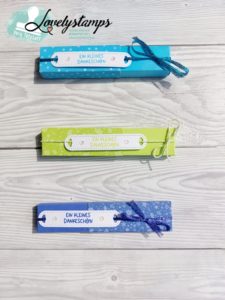 Drei Schokoladenriegel Verpackungenin Papageiengrün Karibblau und Orchideenlila
