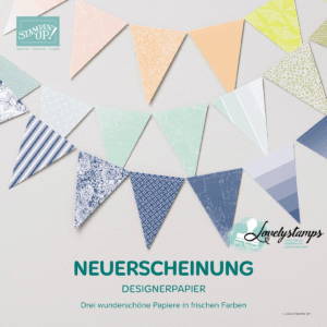 Ein Werbeild mit bunten Wimpeln aus Designerpapier mit der Aufschrift "Neuerscheinung Designerpapier"